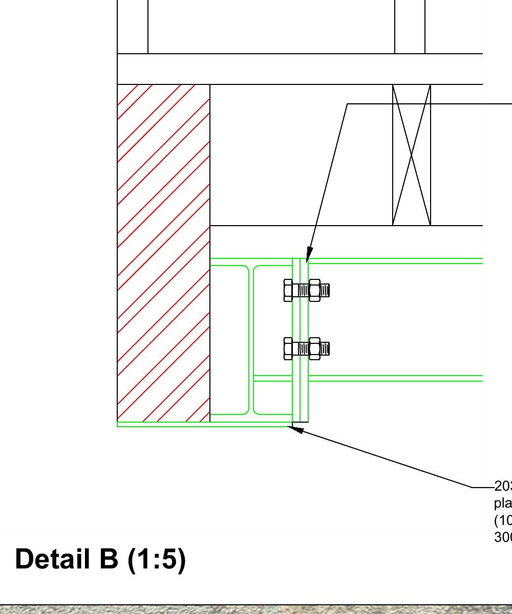 Detail of a bolted steel end-plate connection beside the brick wall